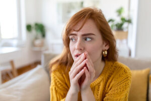 Woman thinking about the signs and symptoms of bipolar disorder
